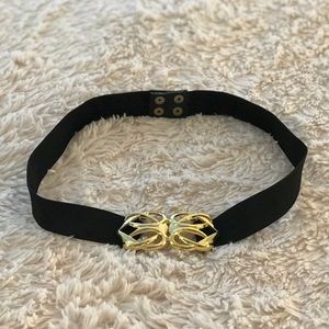 Stretchy black belt with gold buckle